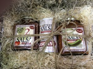 Three jars of salsa tied with twine